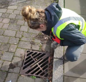 Hannah before opening a drain guard