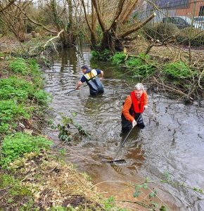 Raking gravel into the River Blackwater